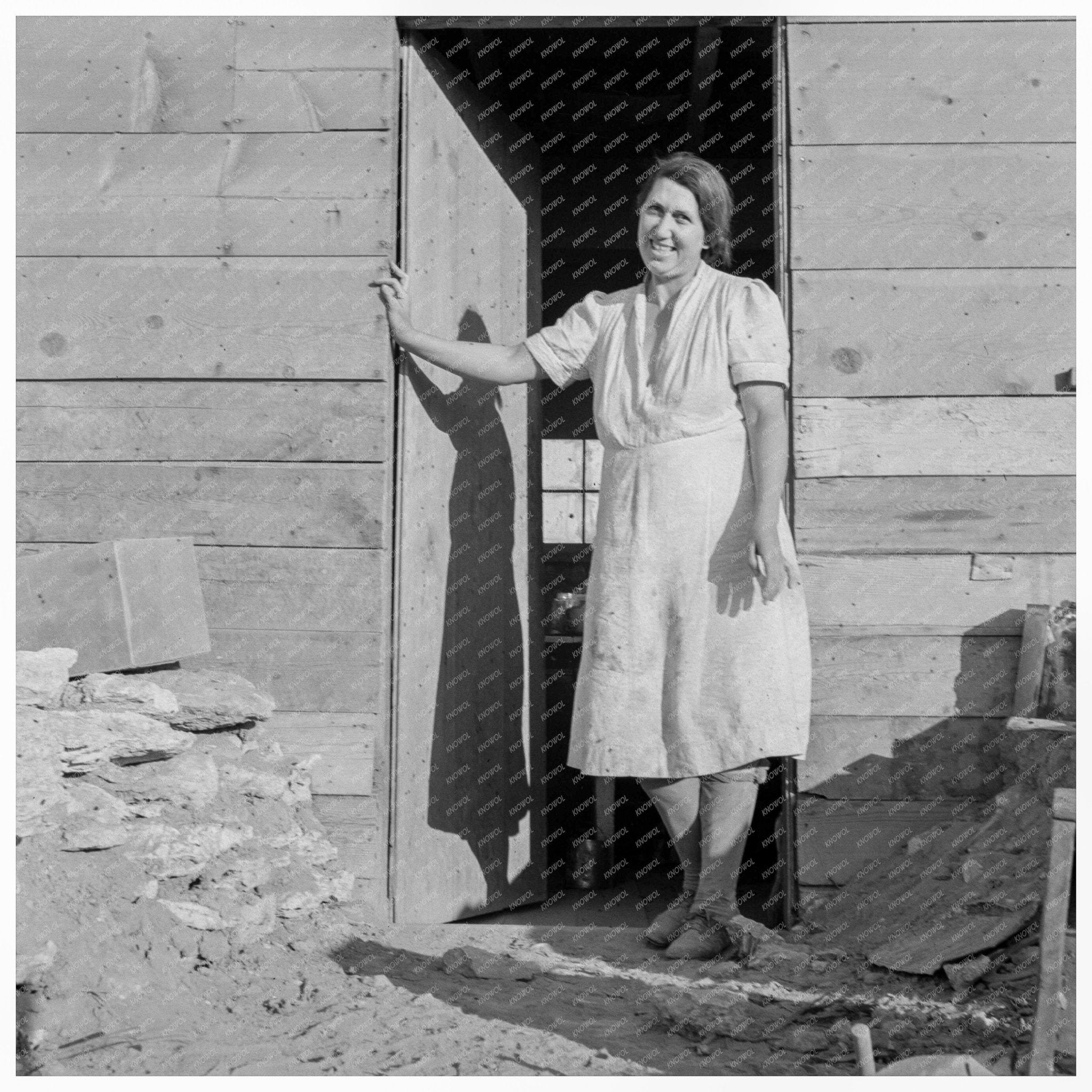 Mrs. Dougherty in Doorway of Basement House 1939 - Available at KNOWOL