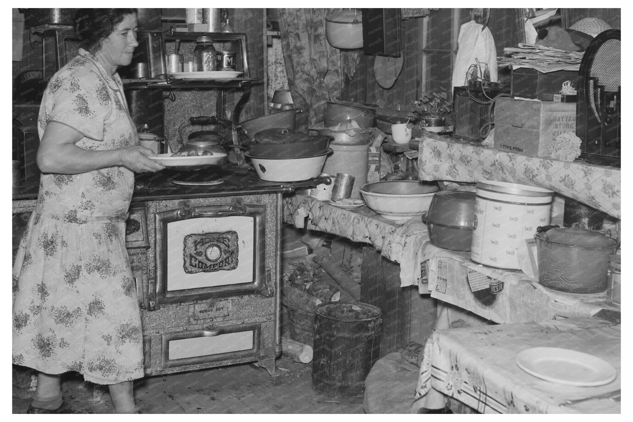 Mrs. Ole Thompson Serving Food in North Dakota 1937 - Available at KNOWOL