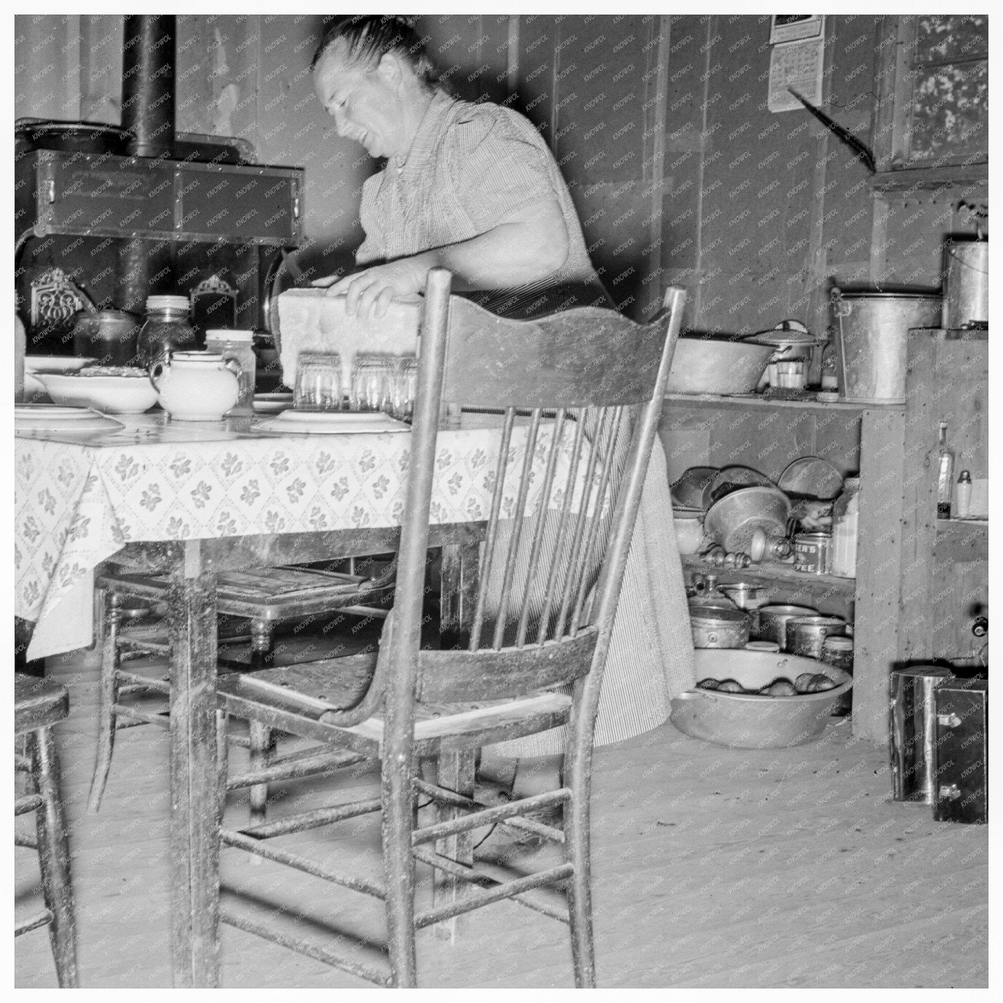 Mrs. Wardlow Bakes Bread in Dugout House Oregon 1939 - Available at KNOWOL