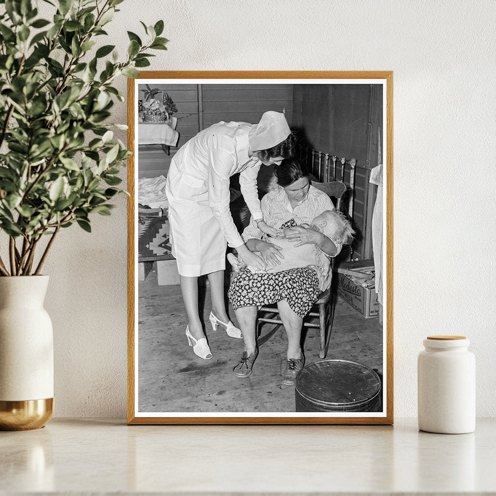 Nurse Attending Sick Infant in FSA Camp 1939 - Available at KNOWOL