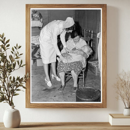 Nurse Attending Sick Infant in FSA Camp 1939 - Available at KNOWOL