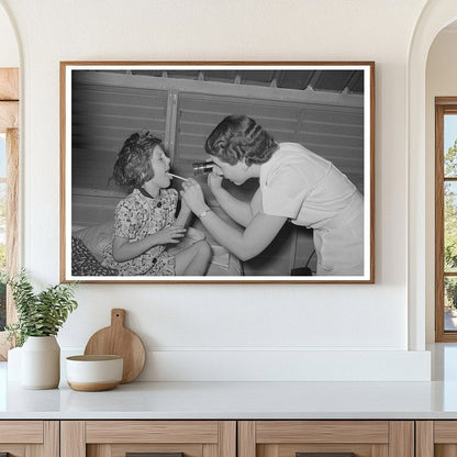 Nurse Examines Child at Agua Fria Labor Camp May 1940 - Available at KNOWOL