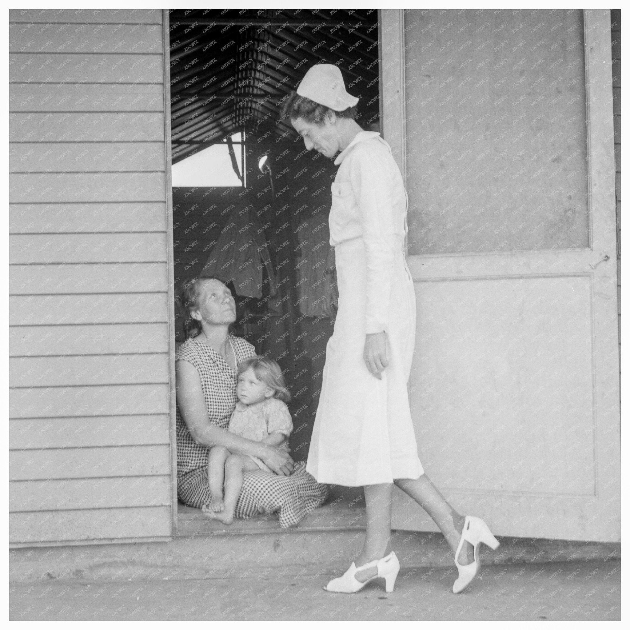 Nurse Visiting Family at Farm Security Camp 1939 - Available at KNOWOL