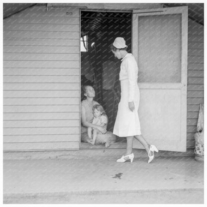 Nurse Visits Family in FSA Camp May 1939 - Available at KNOWOL