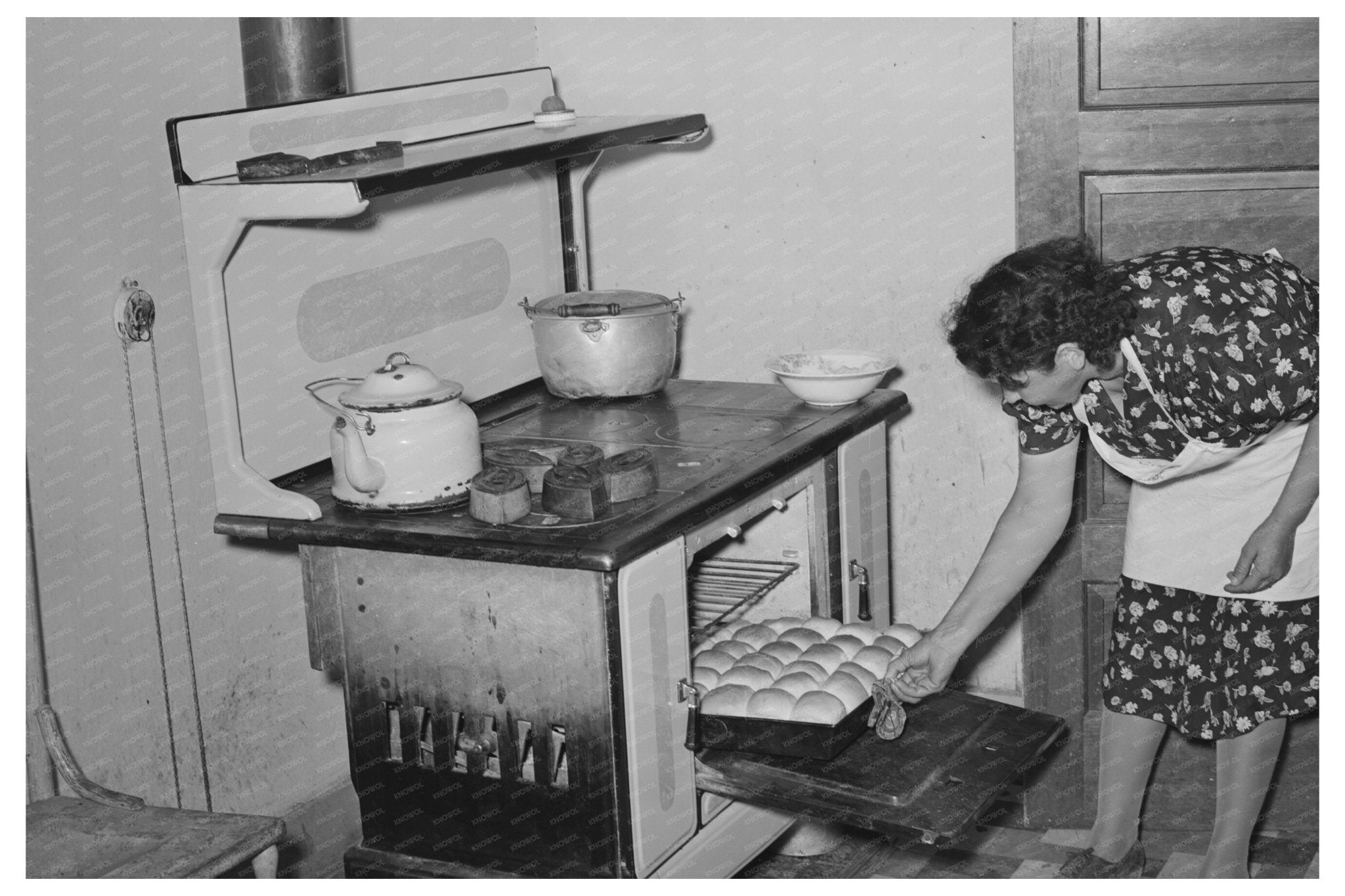 Ofelia Sandoval Baking Bread in Taos New Mexico 1939 - Available at KNOWOL