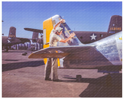 Painter Cleans P - 51 Fighter Tail Section October 1942 - Available at KNOWOL