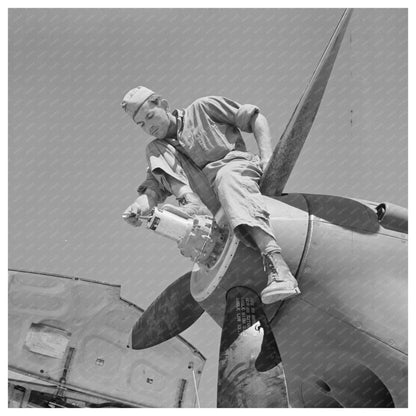 Repairman on Airplane Propeller Hub Lake Muroc 1942 - Available at KNOWOL