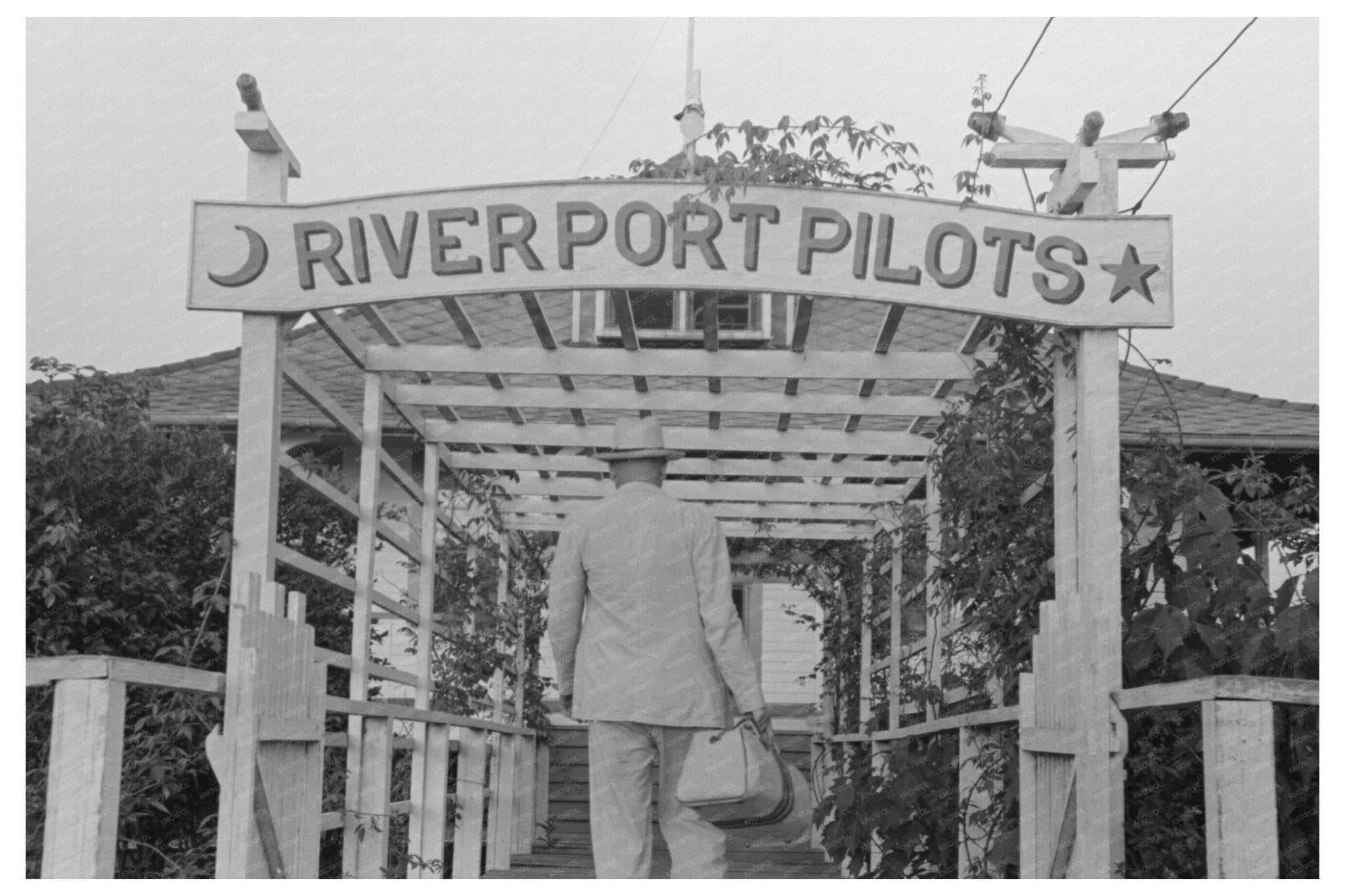 River Pilot Entering Clubhouse in Pilottown Louisiana 1938 - Available at KNOWOL