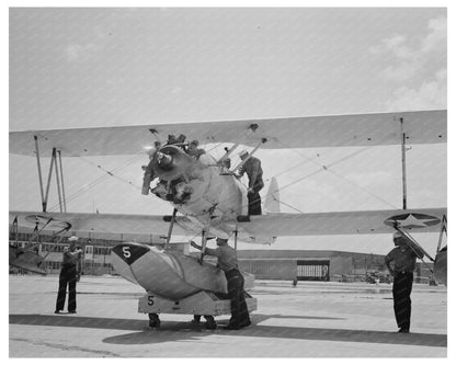 Sailor Inspects N3N Seaplane Corpus Christi August 1942 - Available at KNOWOL