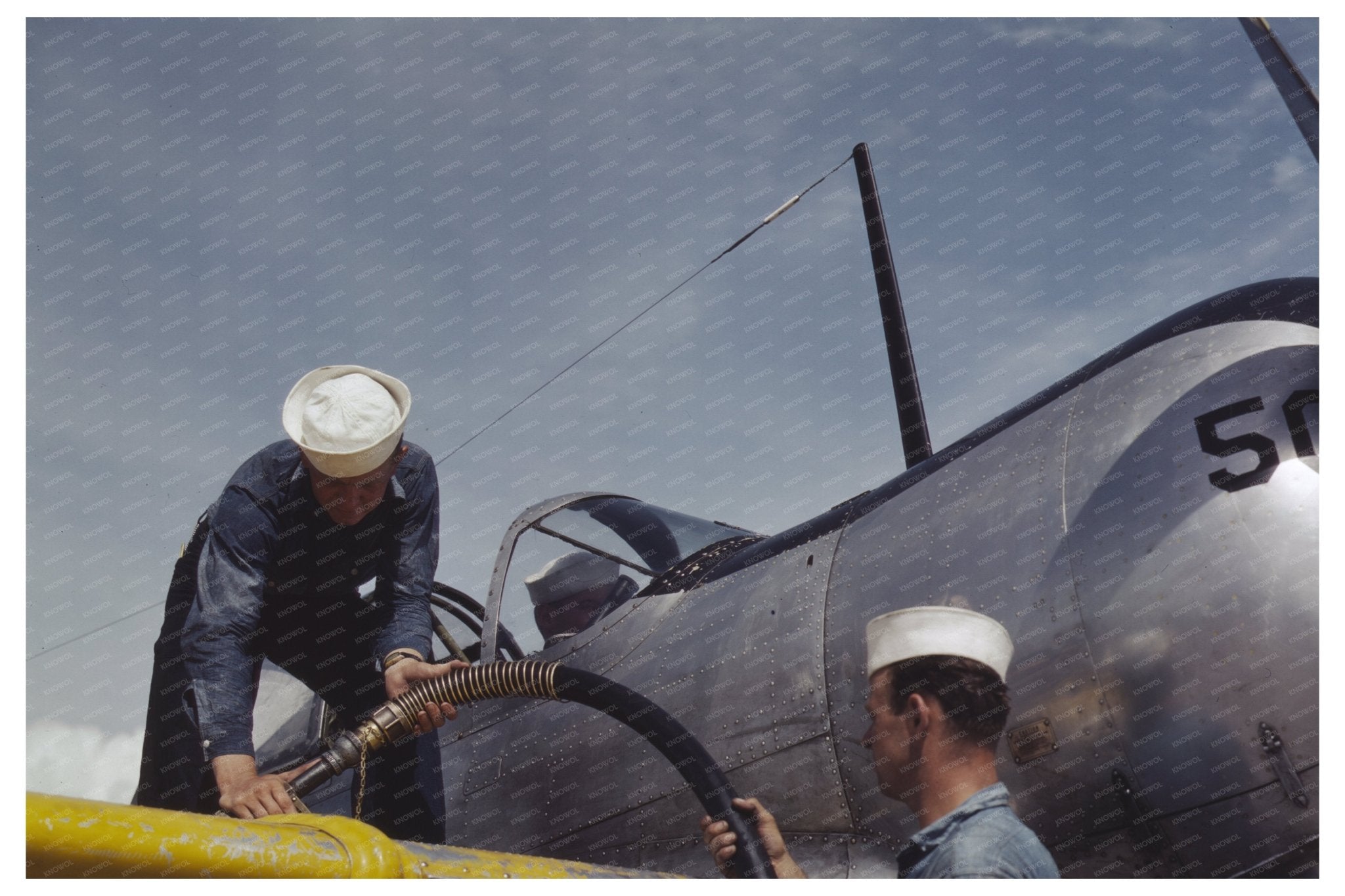 Sailor Mechanics Refueling SNC Plane Corpus Christi 1942 - Available at KNOWOL