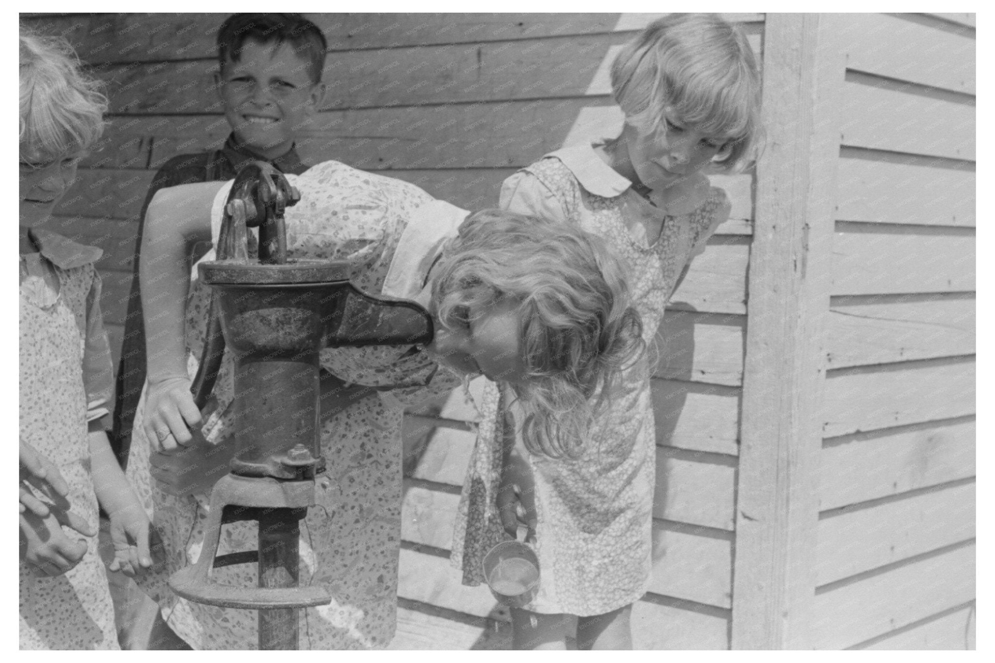 Schoolchildren at Water Pump in Southeast Missouri 1938 - Available at KNOWOL