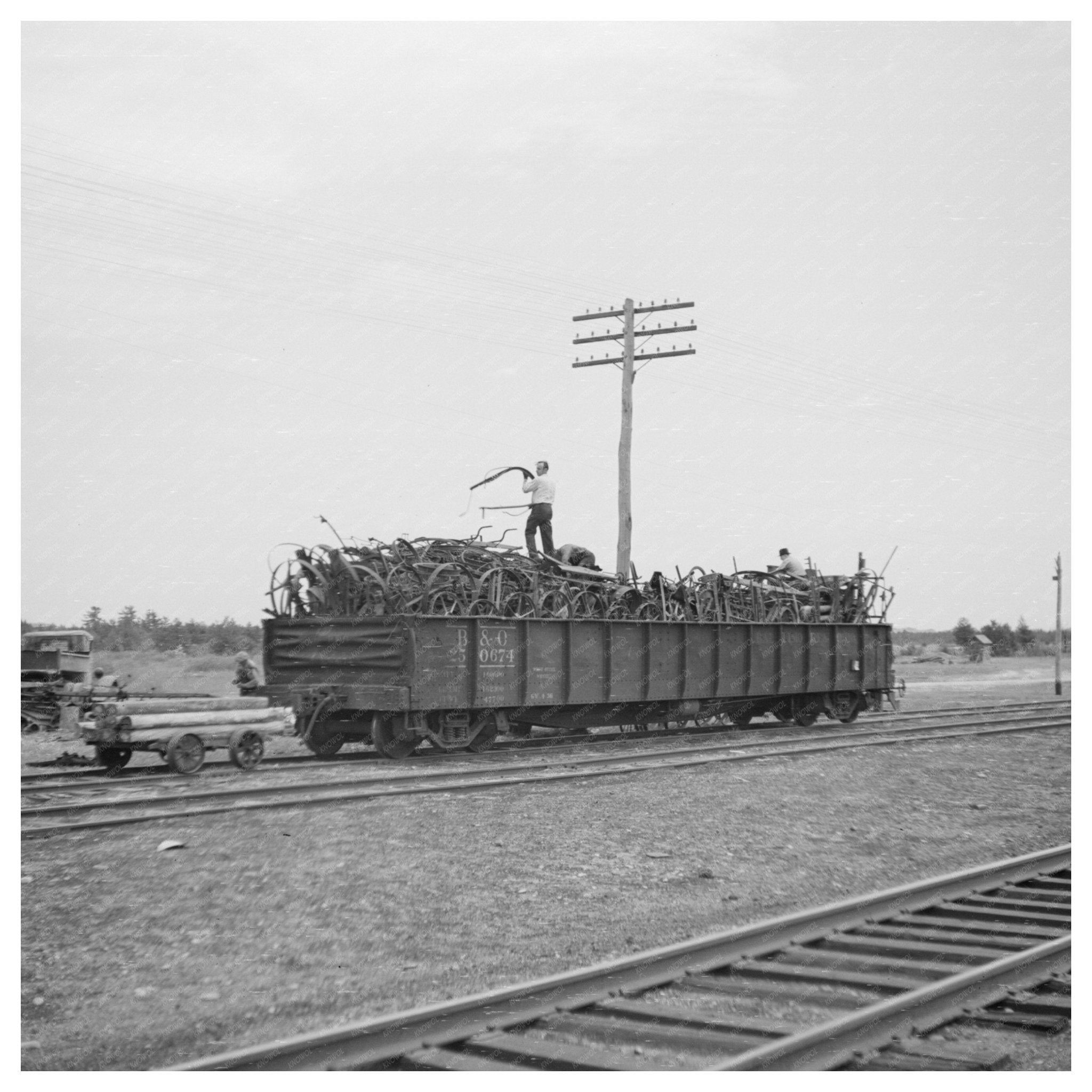 Scrap Iron Loading into Railroad Cars Millville Wisconsin 1937 - Available at KNOWOL