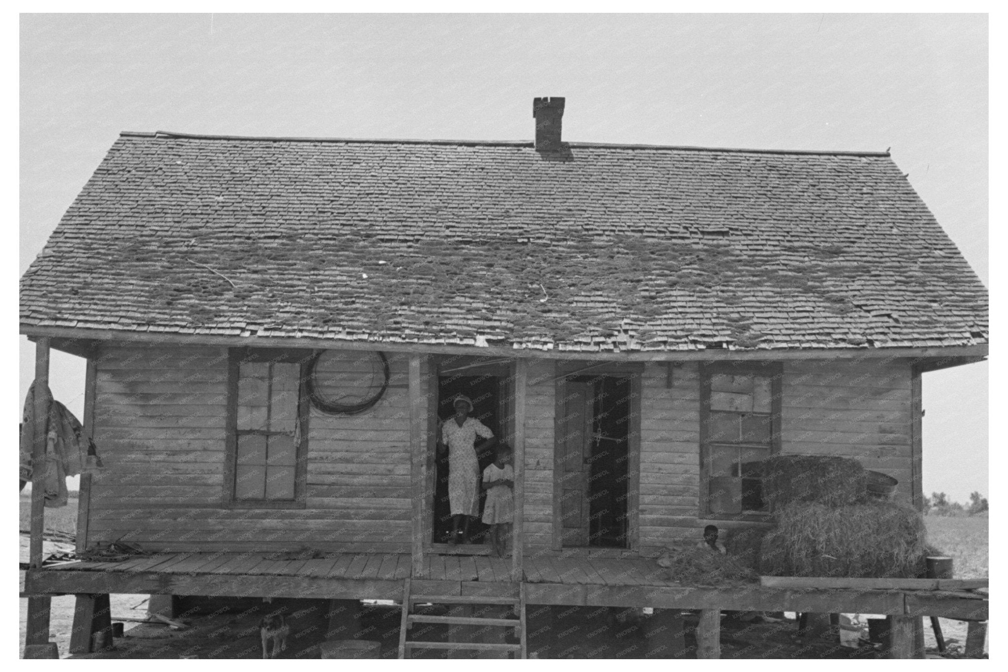 Sharecropper Family on Cabin Porch Southeast Missouri 1938 - Available at KNOWOL