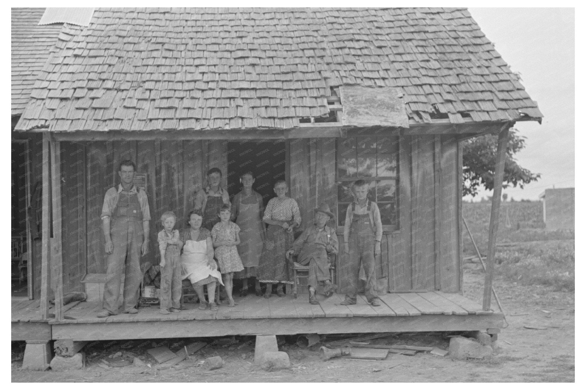 Sharecropper Family on Porch Southeast Missouri 1938 - Available at KNOWOL