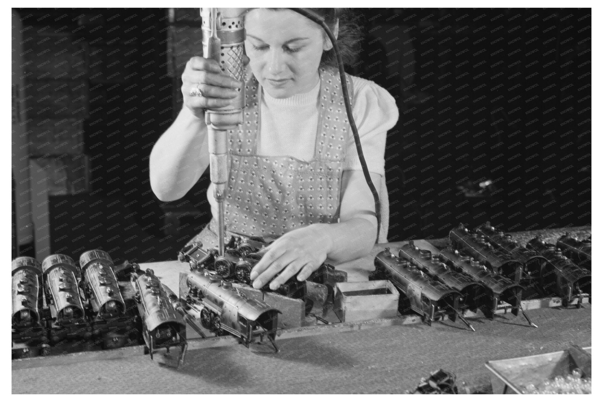 Stephanie Cewe Assembling Toy Trains in 1942 - Available at KNOWOL