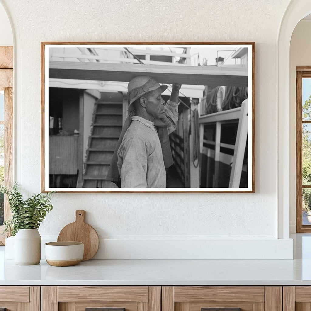 Stevedore Carrying Lumber in New Orleans 1938 - Available at KNOWOL