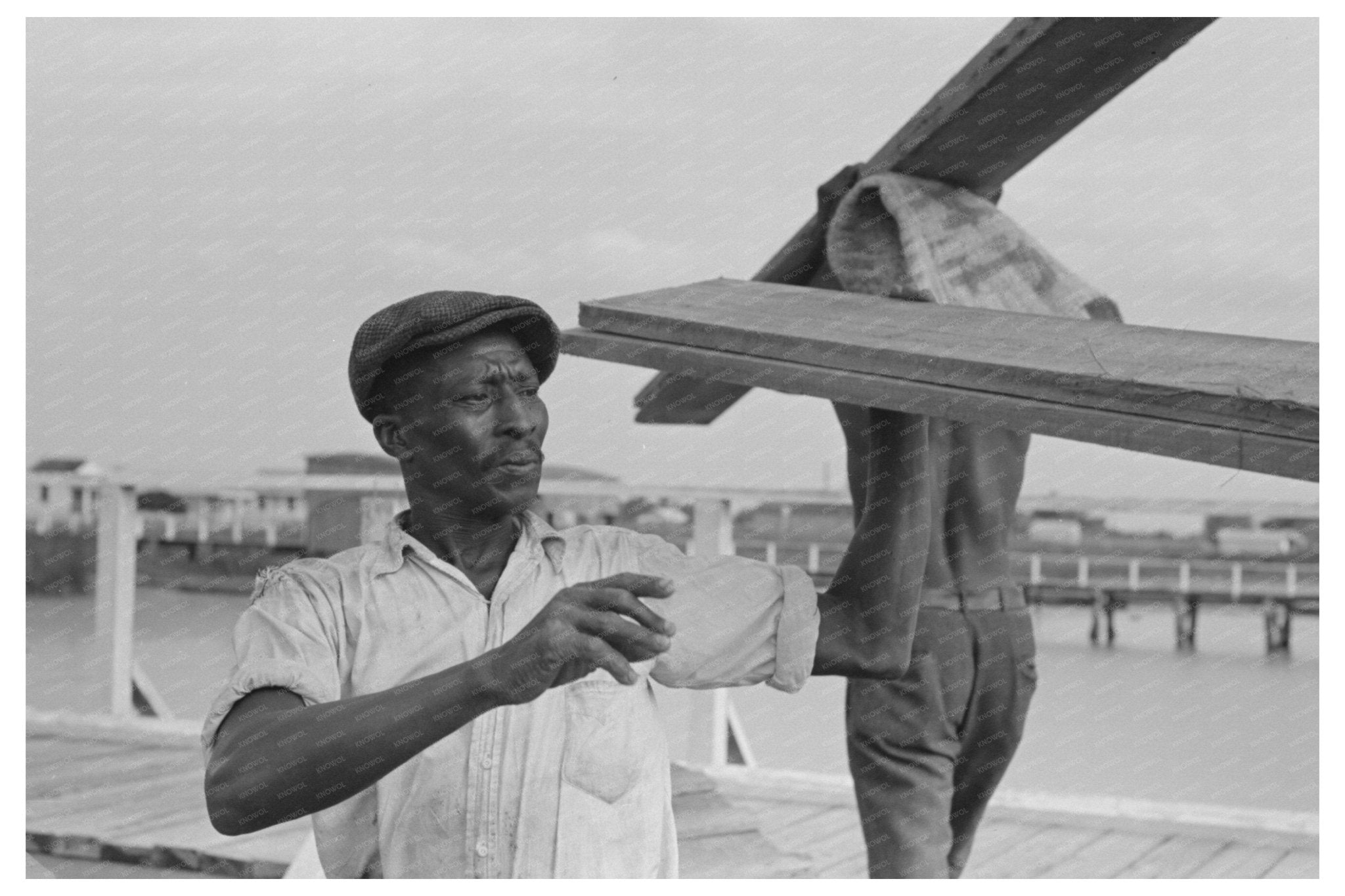 Stevedore Handling Lumber at Pilottown Louisiana 1938 - Available at KNOWOL