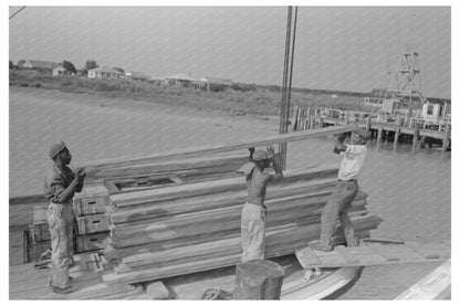 Stevedores Loading Stove on Boat Burwood Louisiana 1938 - Available at KNOWOL