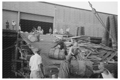 Stevedores Maneuver Drums in New Orleans 1938 - Available at KNOWOL