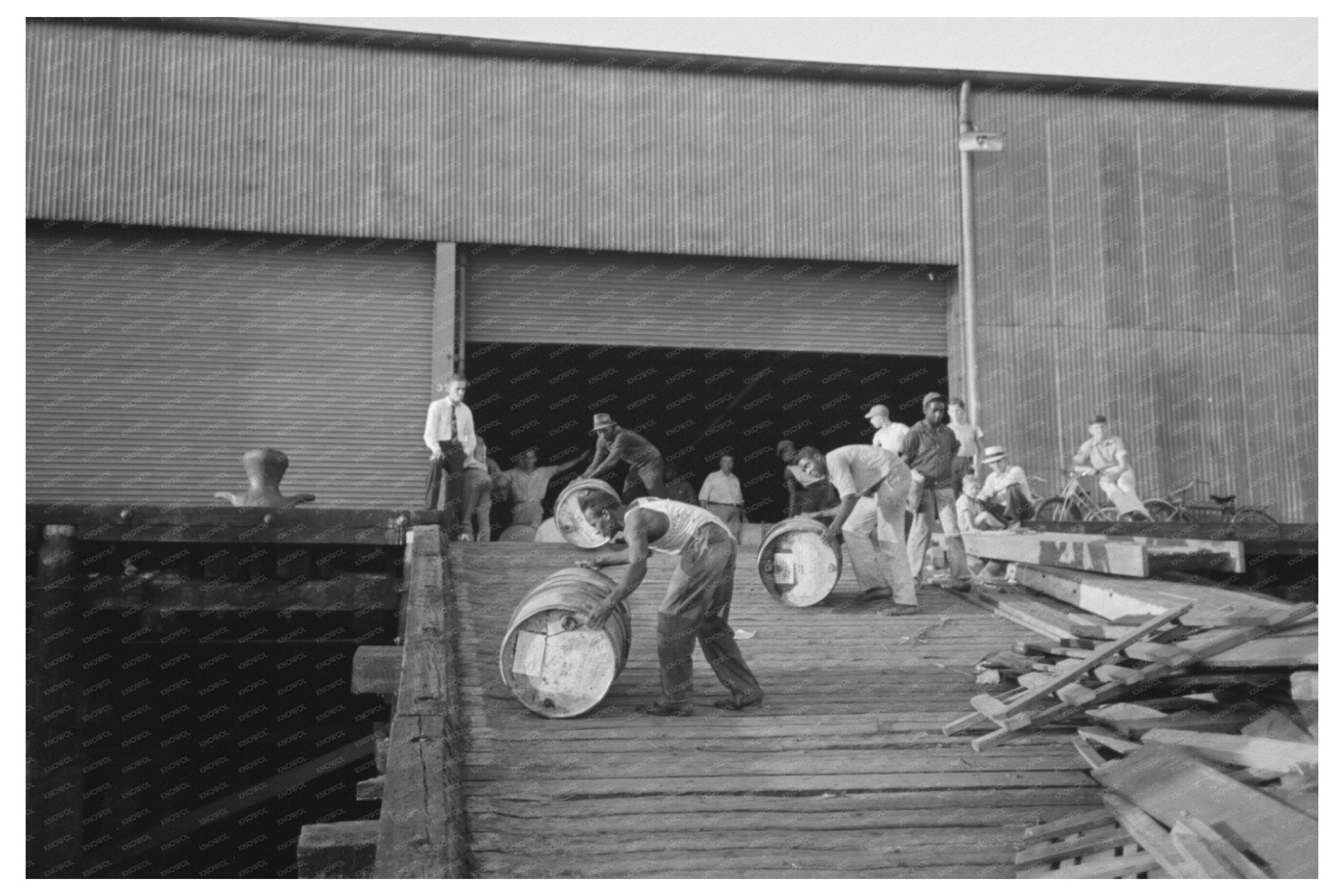 Stevedores Moving Drums in New Orleans September 1938 - Available at KNOWOL