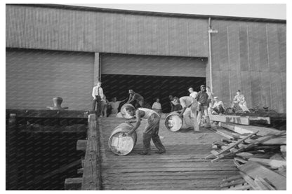 Stevedores Moving Drums in New Orleans September 1938 - Available at KNOWOL