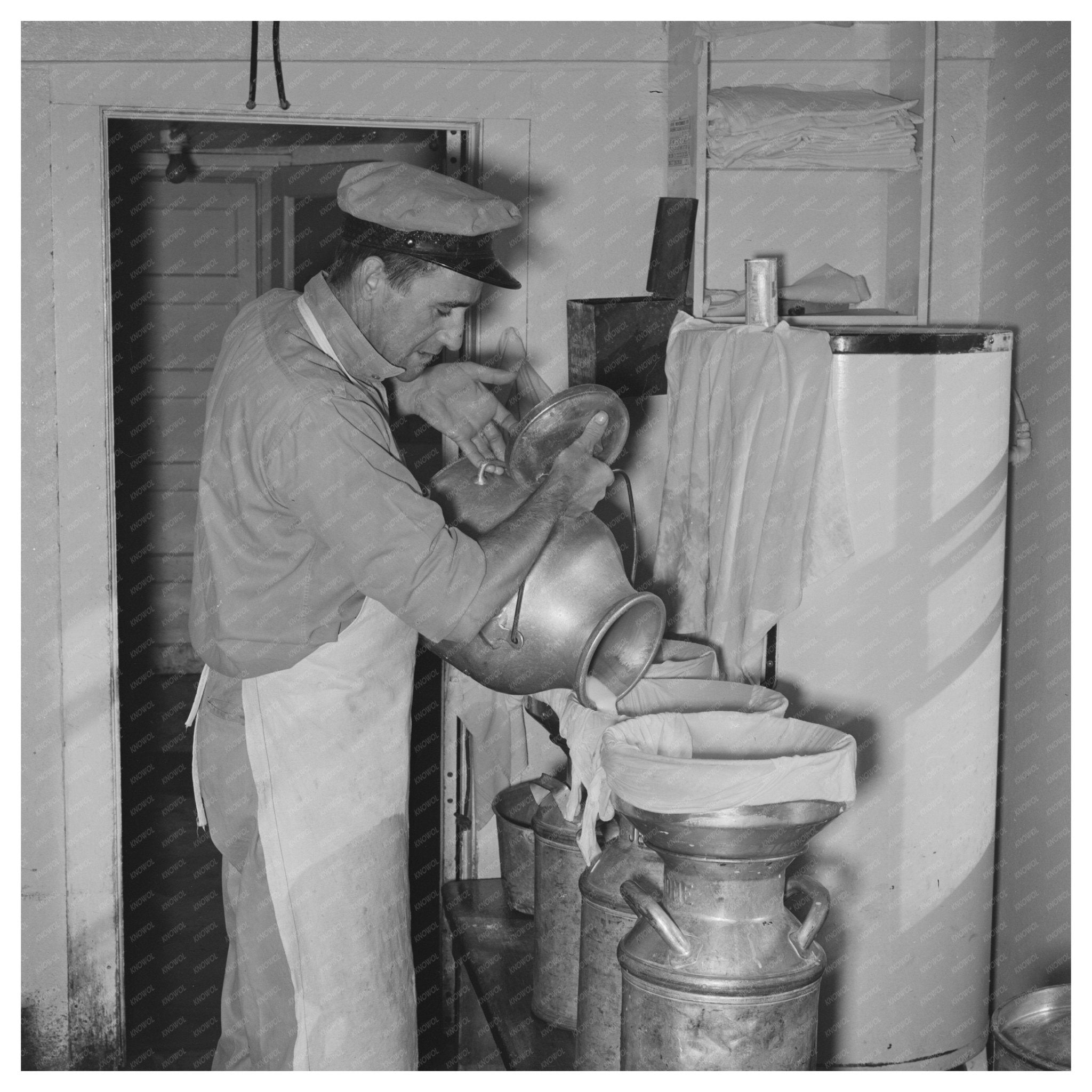 Straining Milk at Dairy Farm in Tom Green County 1939 - Available at KNOWOL