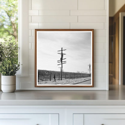 Telephone Linesmen Raising Wires Above Flood Level 1937 - Available at KNOWOL