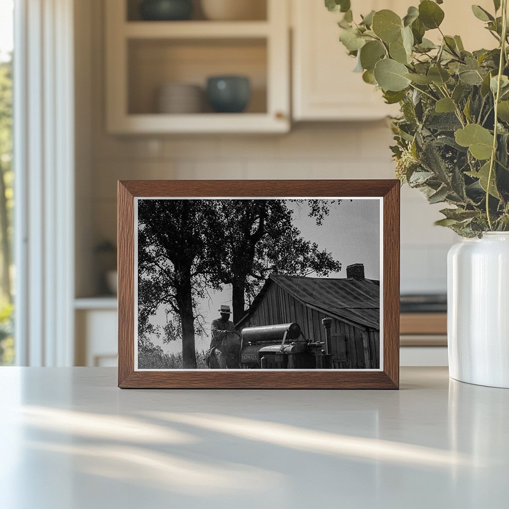 Tractor and Driver at Aldridge Plantation Mississippi 1937 - Available at KNOWOL