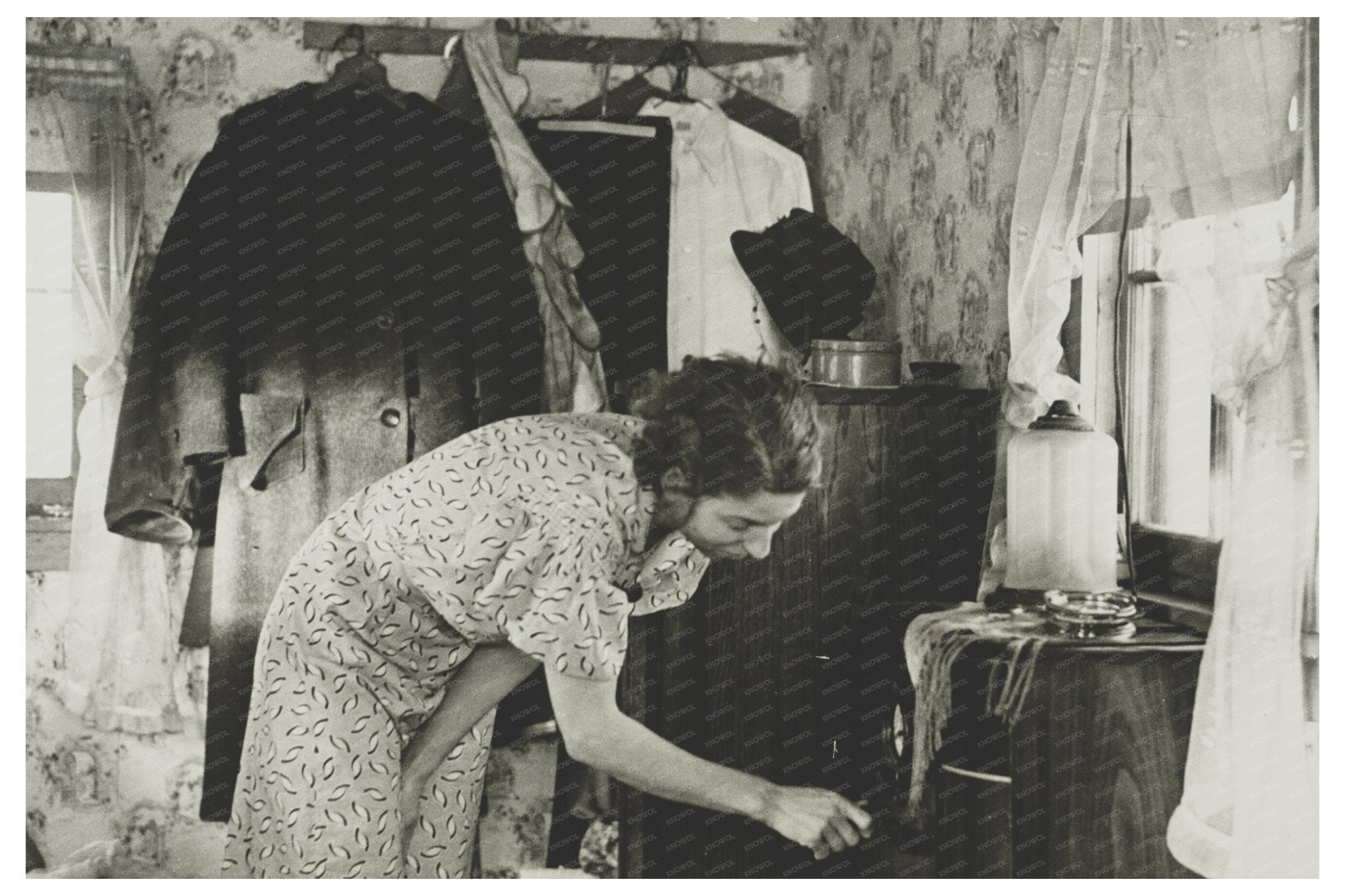 Vintage 1936 Photograph of Woman Winding Clock in Shack - Available at KNOWOL