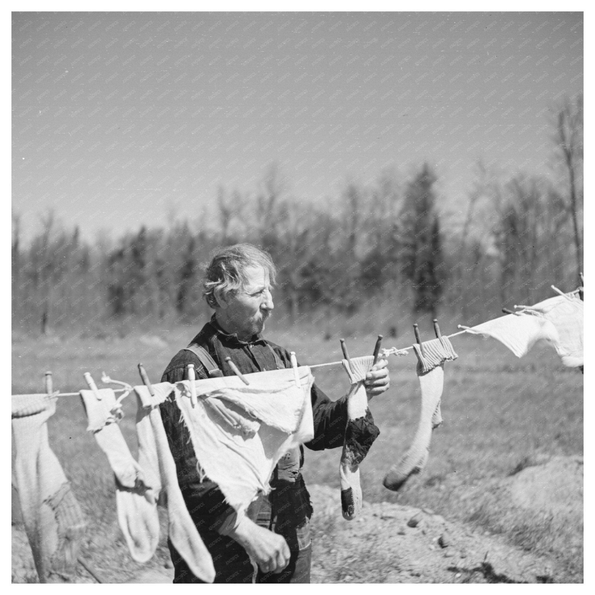 Vintage Photograph of John Bastia Hanging Laundry 1937 - Available at KNOWOL