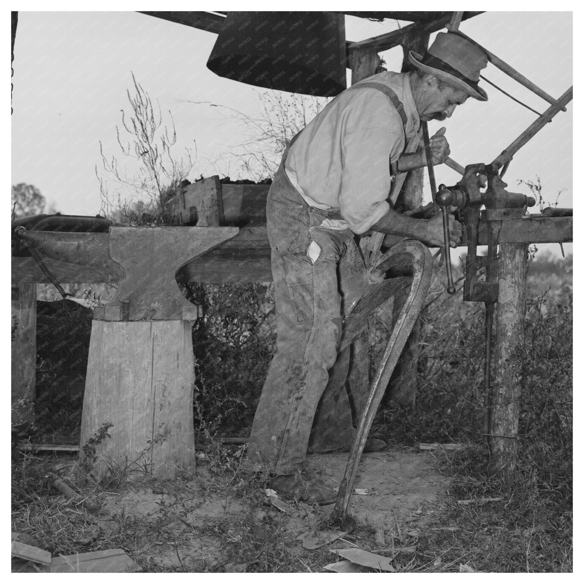 W.E. Smith Blacksmithing a Plow 1938 Morganza Louisiana - Available at KNOWOL