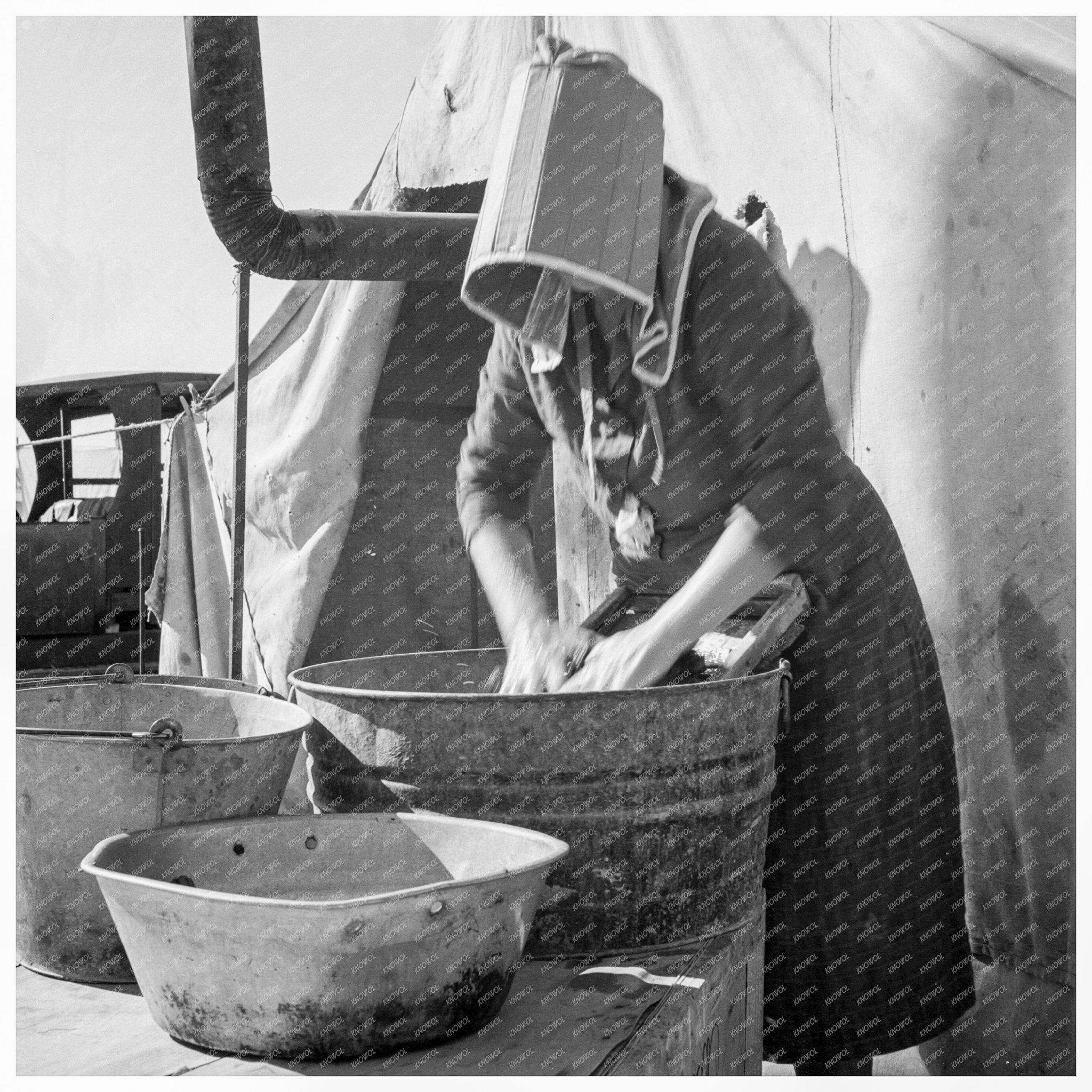 Woman in Sunbonnet at Carrot Pullers Camp 1939 - Available at KNOWOL