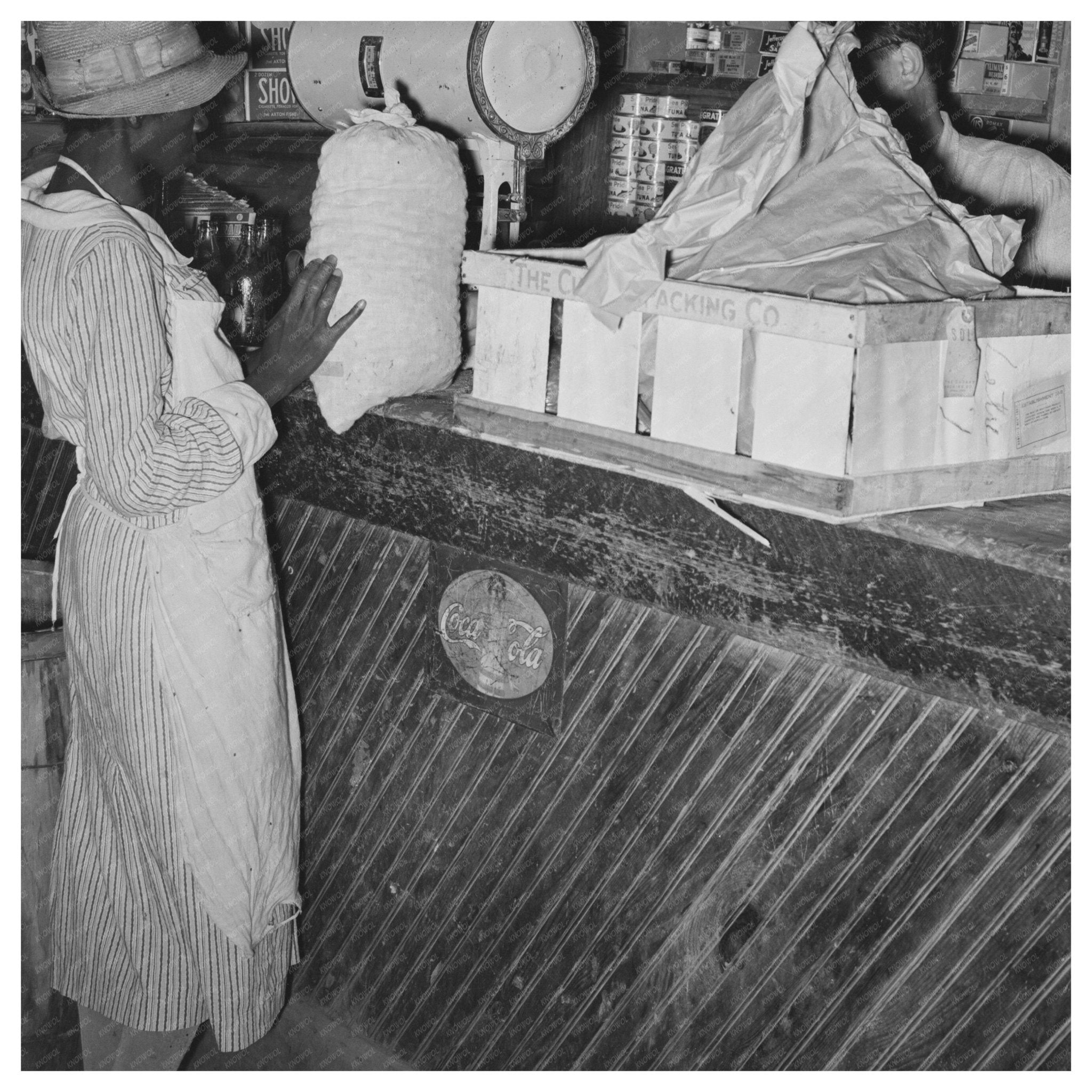 Woman Trading Pecans for Groceries in 1938 Louisiana - Available at KNOWOL