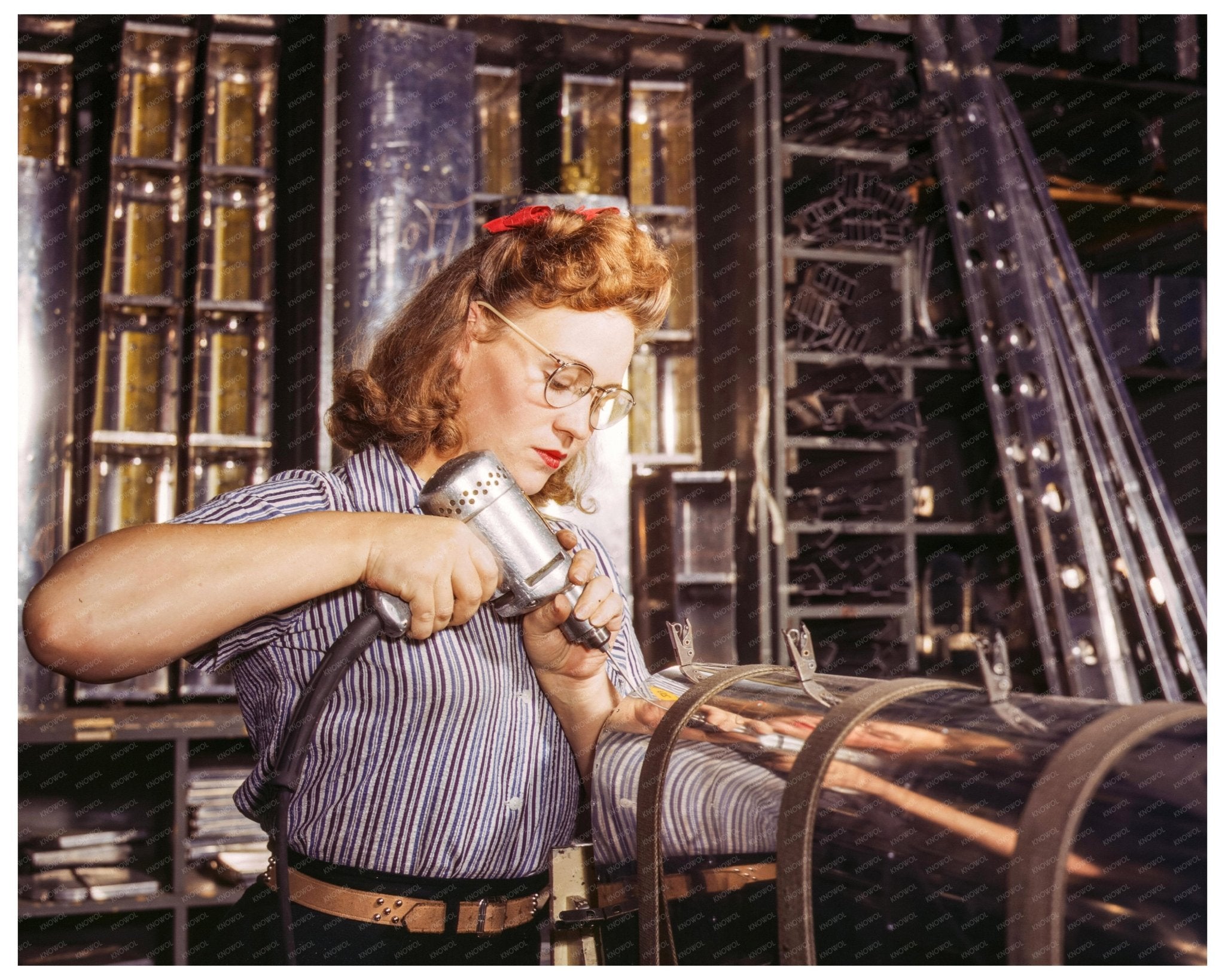 Woman Using Hand Drill in Aviation Industry 1942 - Available at KNOWOL