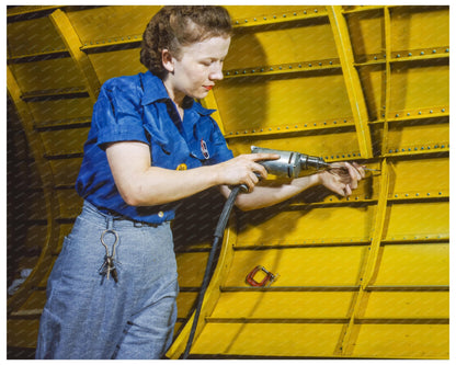 Woman Using Hand Drill on Vengeance Dive Bomber 1943 - Available at KNOWOL