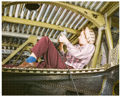 Woman Worker Riveting A - 20 Bomber October 1942 - Available at KNOWOL