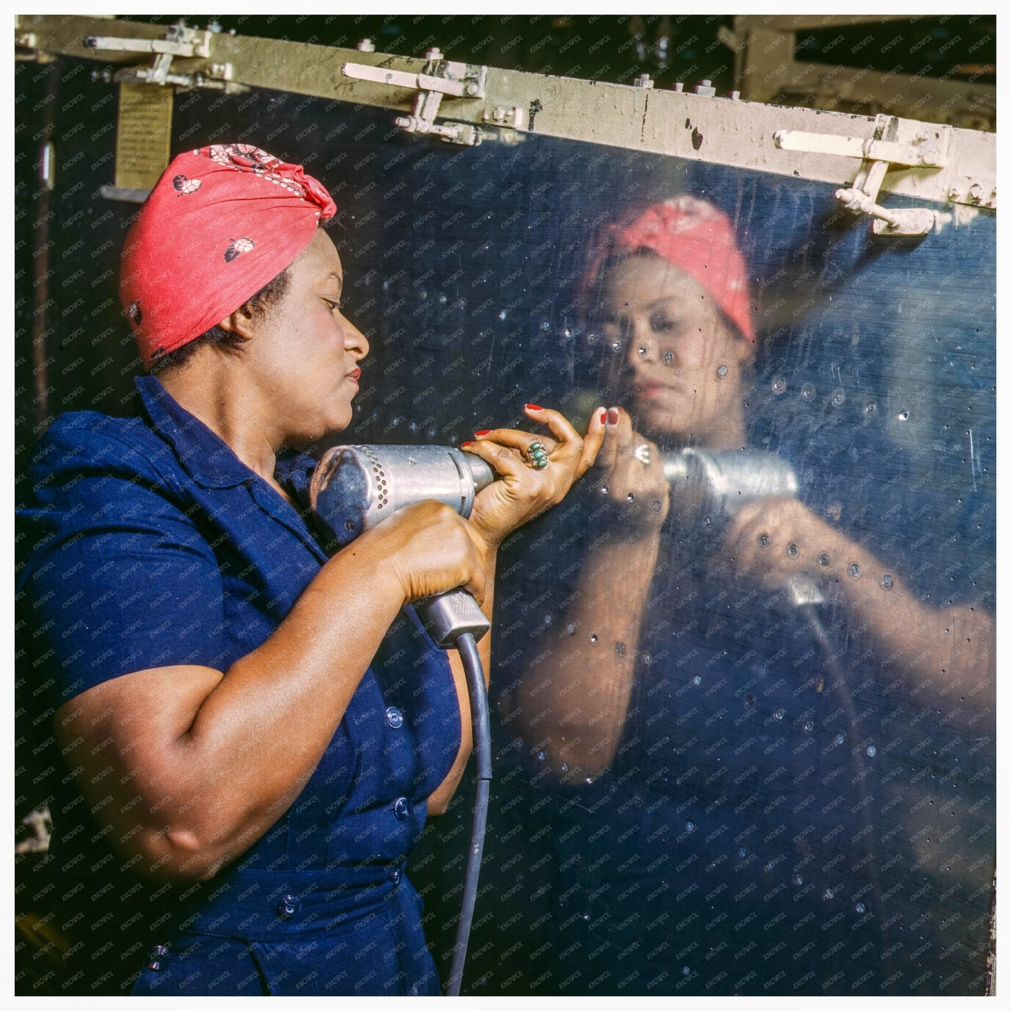 Women in WWII: African American Woman Operating Rivet Gun on Vengeance Dive Bomber 1943 - Available at KNOWOL