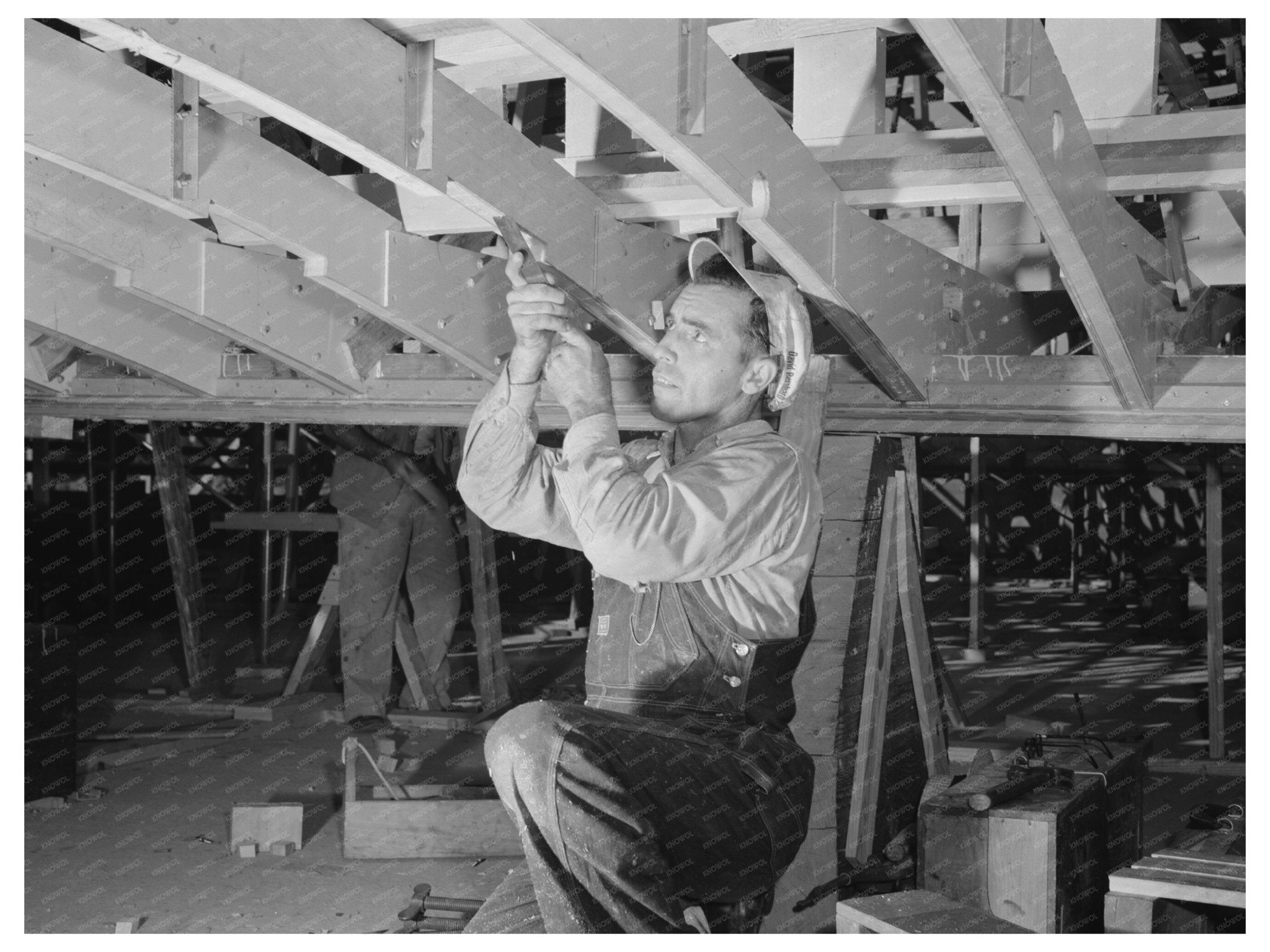 Worker Chiseling Wooden Beam for Torpedo Boat 1942 - Available at KNOWOL