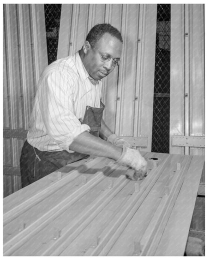 Worker Cleaning Wing Parts at Briggs Manufacturing Company February 1942 - Available at KNOWOL