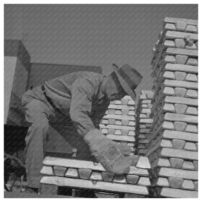 Workers Handling Hot Magnesium Ingots 1943 - Available at KNOWOL