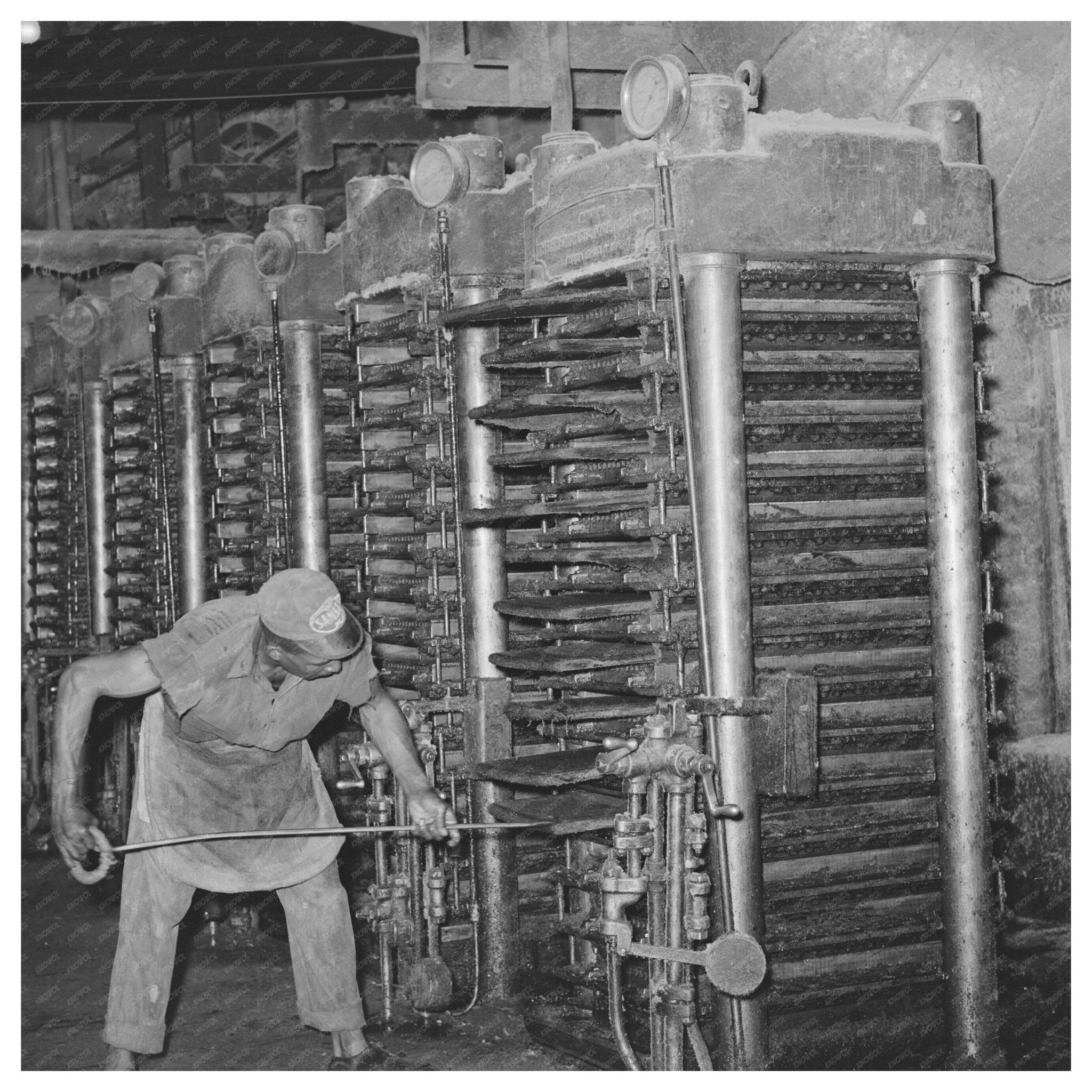 Workers Removing Cotton Cake in Texas Oil Mill 1939 - Available at KNOWOL