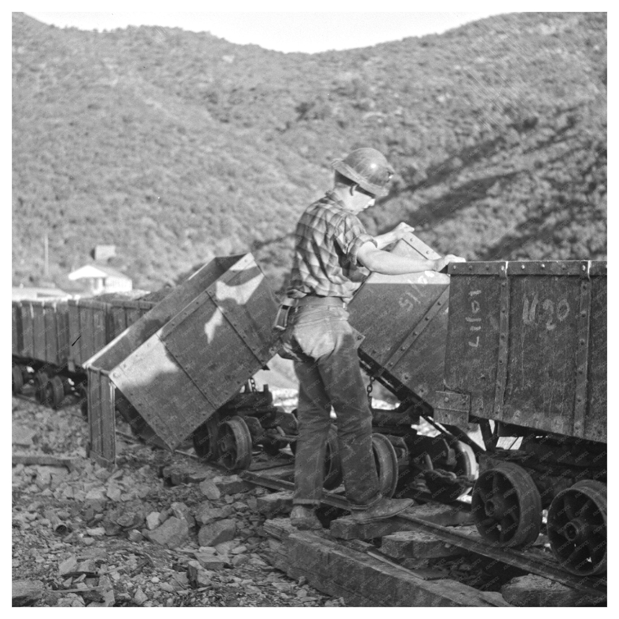 Workman Detaching Mine Cars at Boriana Mine Circa 1940 - Available at KNOWOL